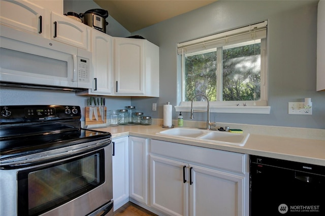 348 Cockle St SW, Ocean Shores, WA 98569 - kitchen featuring dishwasher, a sink, stainless steel electric stove, white cabinetry, and white microwave