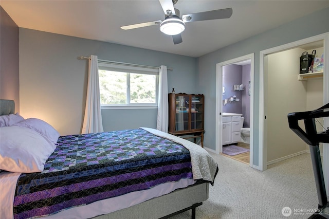 348 Cockle St SW, Ocean Shores, WA 98569 - bedroom with ensuite bathroom, carpet, baseboards, and a ceiling fan
