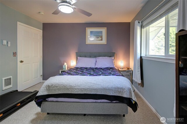 348 Cockle St SW, Ocean Shores, WA 98569 - carpeted bedroom with baseboards and a ceiling fan