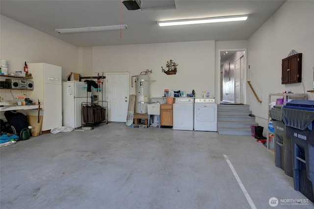 348 Cockle St SW, Ocean Shores, WA 98569 - garage with freestanding refrigerator, a workshop area, electric panel, electric water heater, and independent washer and dryer