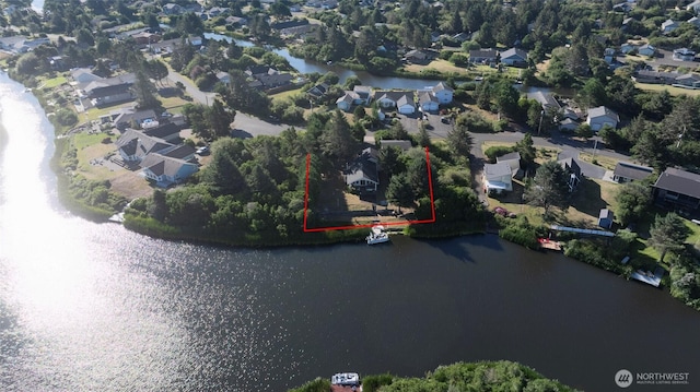 348 Cockle St SW, Ocean Shores, WA 98569 - drone / aerial view with a water view and a residential view