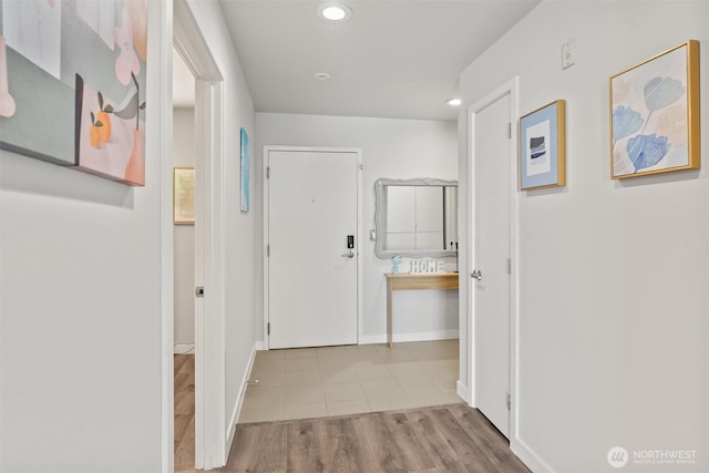 321 10th Ave S Unit 705, Seattle, WA 98104 - hallway with recessed lighting, wood finished floors, and baseboards