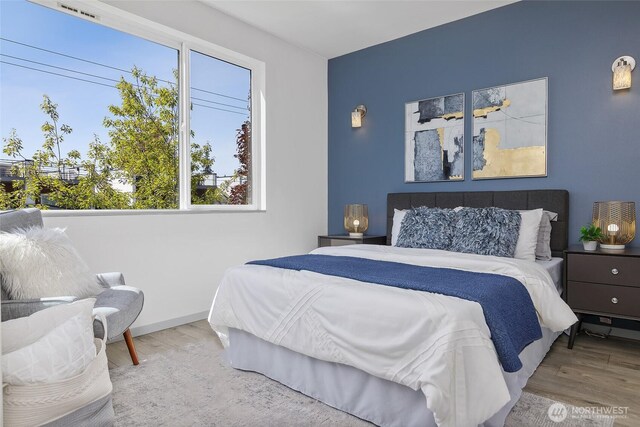 bedroom with wood finished floors