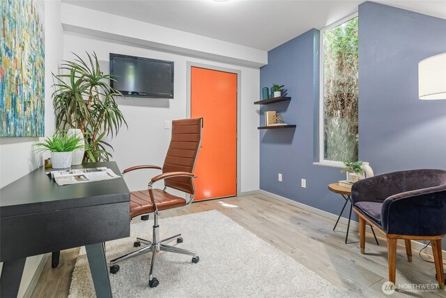 office space featuring wood finished floors and baseboards