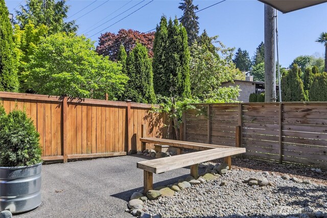 fenced backyard with a patio area