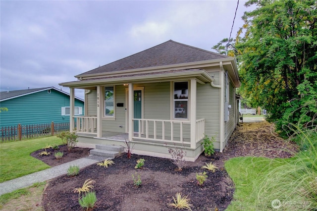 1813 10th St, Anacortes, WA 98221 - view of front of house with a porch and roof with shingles
