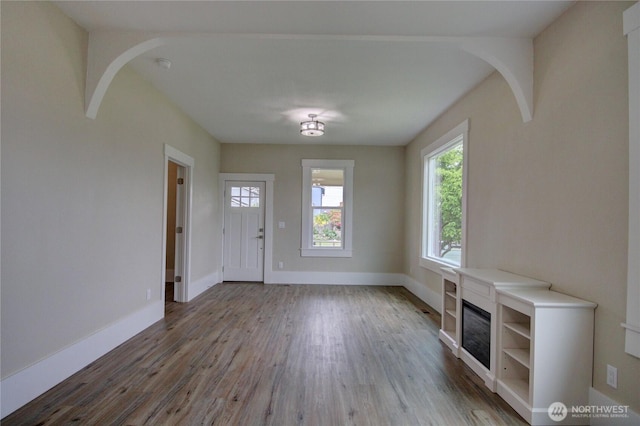 1813 10th St, Anacortes, WA 98221 - entryway with wood finished floors, baseboards, and a fireplace
