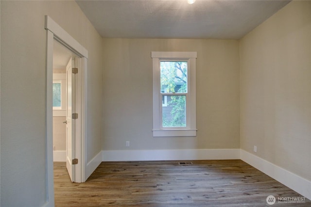 1813 10th St, Anacortes, WA 98221 - spare room with wood finished floors and baseboards