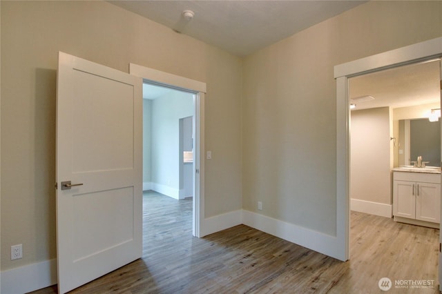 1813 10th St, Anacortes, WA 98221 - empty room featuring light wood finished floors and baseboards
