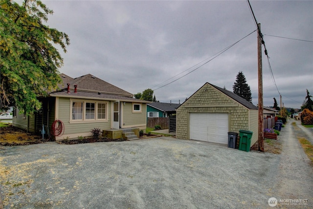 1813 10th St, Anacortes, WA 98221 - bungalow-style home with a detached garage, an outbuilding, and driveway