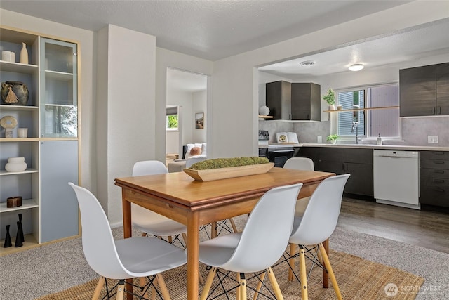 dining room with light carpet