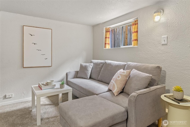 living room with a textured wall, carpet floors, a textured ceiling, and baseboards