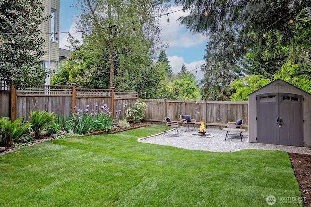 view of yard with a storage unit, an outbuilding, and a patio
