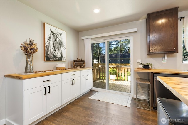 entryway with dark wood-type flooring and recessed lighting