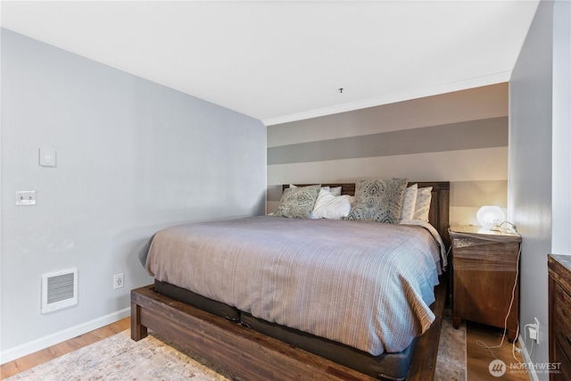 12515 109th Ct NE Unit B104, Kirkland, WA 98034 - bedroom with baseboards, wood finished floors, and ornamental molding