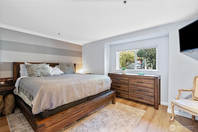 12515 109th Ct NE Unit B104, Kirkland, WA 98034 - bedroom featuring light wood-style floors, ornamental molding, and baseboards