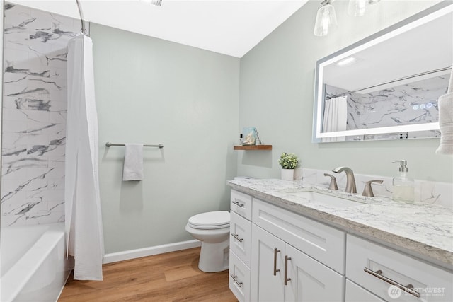 12515 109th Ct NE Unit B104, Kirkland, WA 98034 - full bathroom with toilet, wood finished floors, vanity, baseboards, and shower / bath combo