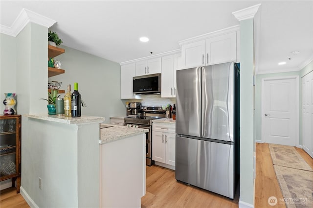 12515 109th Ct NE Unit B104, Kirkland, WA 98034 - kitchen with stainless steel appliances, white cabinetry, light wood finished floors, crown molding, and recessed lighting