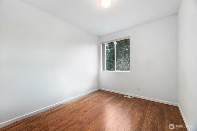 3516 Preston St NE, Lacey, WA 98516 - unfurnished room featuring wood finished floors and baseboards