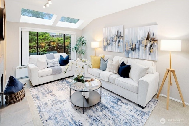 4171 145th Ave NE Unit G2, Bellevue, WA 98007 - carpeted living area featuring a skylight, a baseboard heating unit, lofted ceiling, baseboards, and track lighting