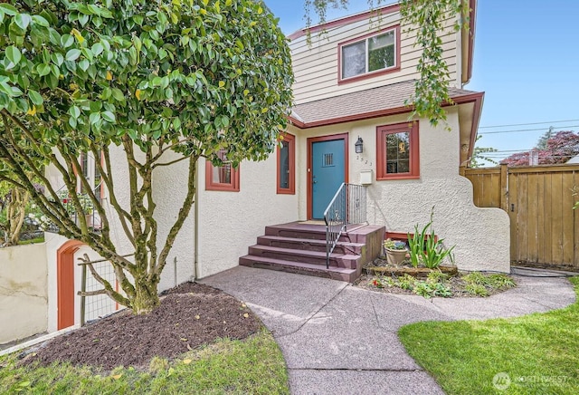 2523 Royal Ct E, Seattle, WA 98112 - townhome / multi-family property featuring stucco siding and fence