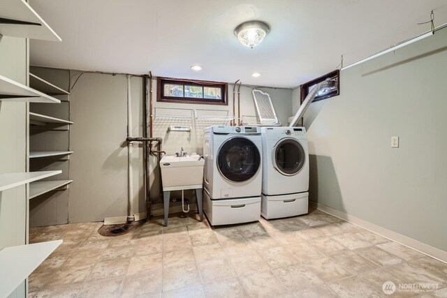 2523 Royal Ct E, Seattle, WA 98112 - washroom with washing machine and dryer, baseboards, and recessed lighting