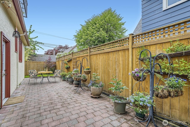 2523 Royal Ct E, Seattle, WA 98112 - view of patio / terrace featuring a fenced backyard and outdoor dining space