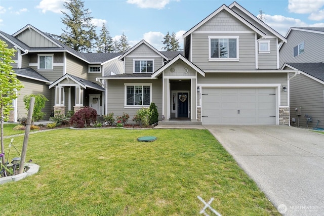 craftsman house with driveway, an attached garage, stone siding, and a front lawn