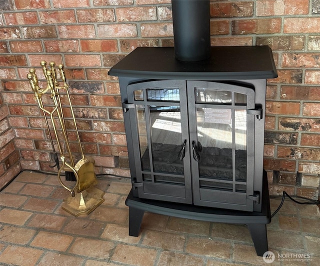 6221 Neylon Dr SW, Olympia, WA 98512 - detailed view of a wood stove and brick wall