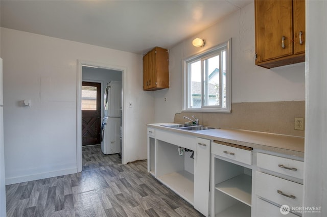 1306 Morgan St, Aberdeen, WA 98520 - kitchen with a sink, freestanding refrigerator, brown cabinets, and light countertops