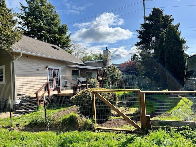 2927 Orleans St, Bellingham, WA 98226 - view of yard with a wooden deck, fence, and french doors