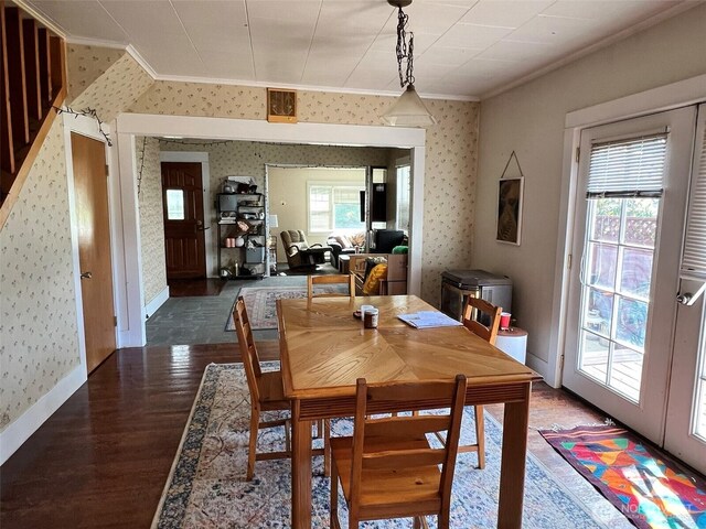 2927 Orleans St, Bellingham, WA 98226 - dining room featuring ornamental molding, wallpapered walls, wood finished floors, and baseboards