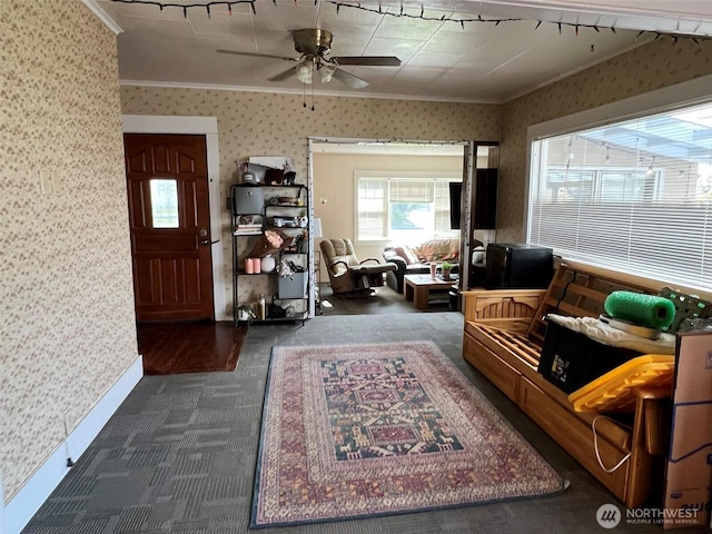 2927 Orleans St, Bellingham, WA 98226 - living room with wallpapered walls, crown molding, dark carpet, a ceiling fan, and baseboards