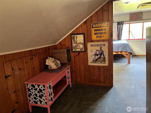 2927 Orleans St, Bellingham, WA 98226 - corridor featuring wood walls, lofted ceiling, carpet floors, and baseboards