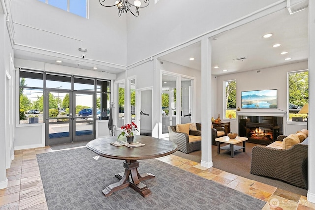 lobby with a towering ceiling and recessed lighting