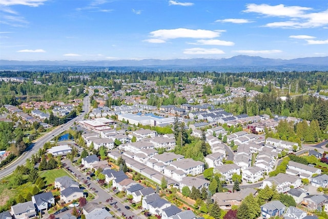 view of property location featuring a mountainous background and nearby suburban area