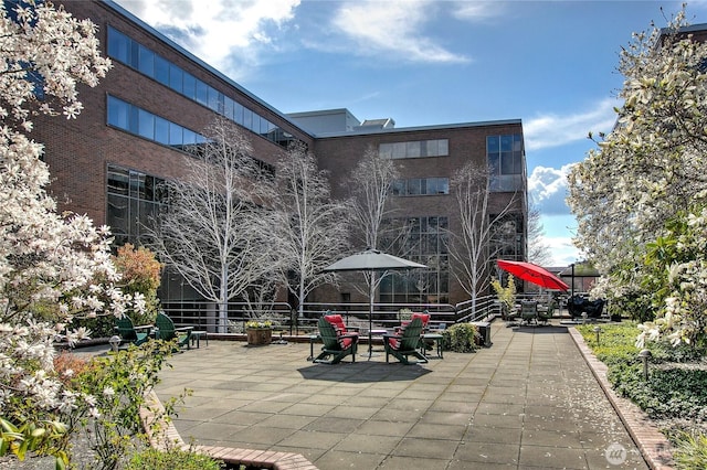 view of home's community with a patio area