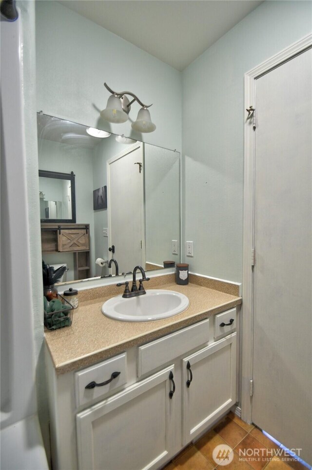 111 E Martin St, Elma, WA 98541 - bathroom with tile patterned flooring and vanity