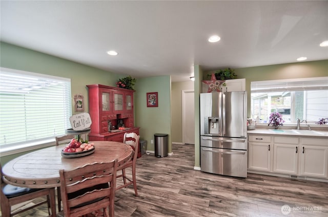 111 E Martin St, Elma, WA 98541 - kitchen featuring a sink, recessed lighting, dark wood-style flooring, stainless steel fridge, and white cabinets