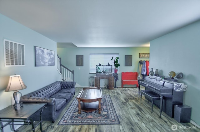 111 E Martin St, Elma, WA 98541 - living area featuring visible vents, wood finished floors, and stairway