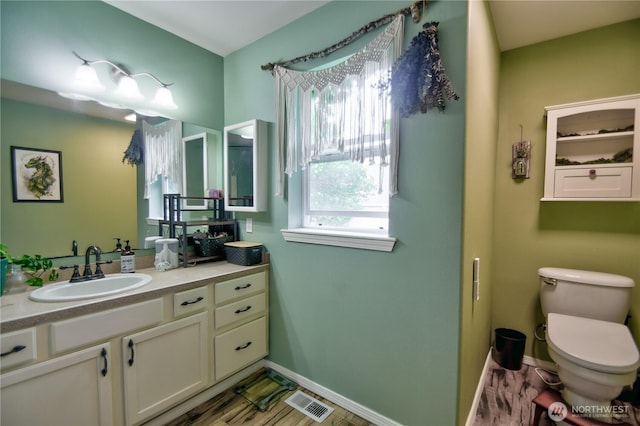 111 E Martin St, Elma, WA 98541 - bathroom with toilet, baseboards, vanity, and visible vents