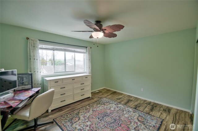 111 E Martin St, Elma, WA 98541 - office area featuring baseboards, a ceiling fan, and wood finished floors