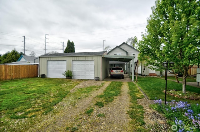 111 E Martin St, Elma, WA 98541 - garage featuring driveway, fence, and a detached garage