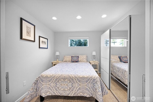 bedroom featuring recessed lighting, carpet, and baseboards