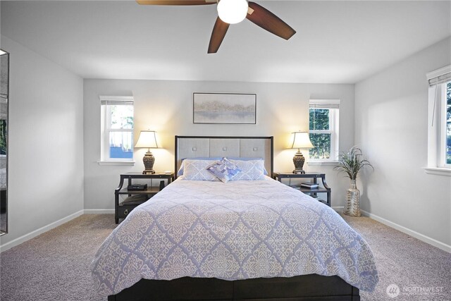 bedroom with carpet flooring, baseboards, and a ceiling fan