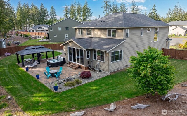 back of property featuring roof with shingles, a gazebo, a patio area, and entry steps