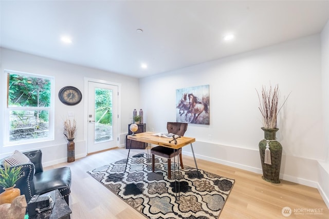 office space featuring light wood-style flooring, baseboards, and recessed lighting