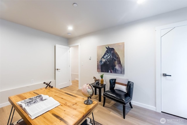 home office with baseboards, light wood-style floors, and recessed lighting