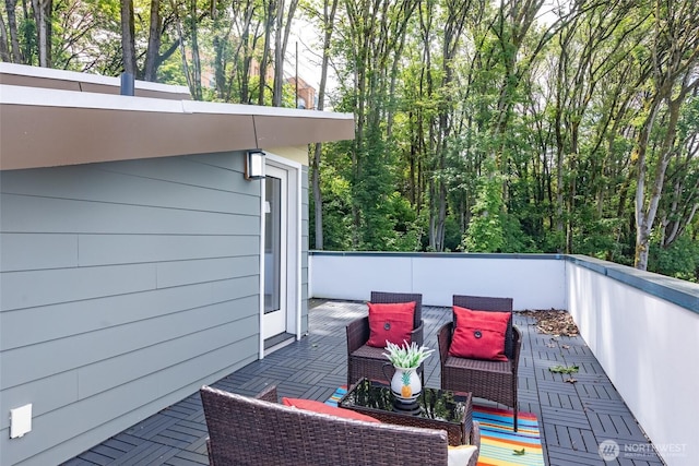 wooden terrace featuring a patio area