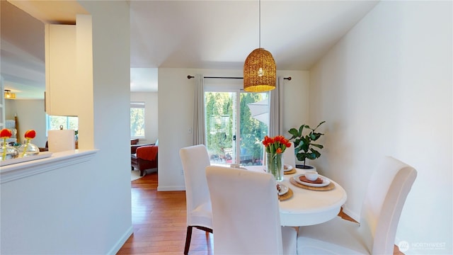 dining room featuring baseboards and wood finished floors